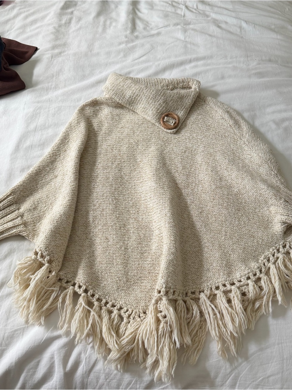 Fringe Trim Cream Knit Poncho with Button Collar